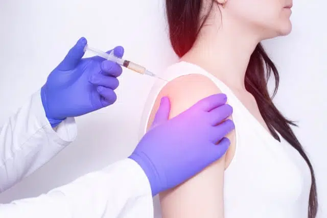 Doctor makes a Connective tissue injection to the patient